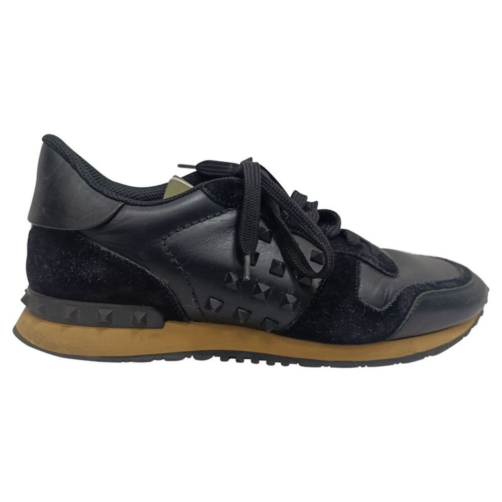 Valentino Garavani Rockrunner Low-Top Sneakers in Black Calf Leather